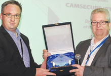 Francois Malan accepts the ‘Partner of the Year 2010’ award for the African region from Peter Biltsted